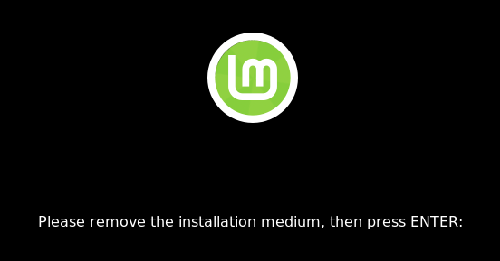 Linux Mint screen asking you to 'Please remove the installation medium, then press ENTER'