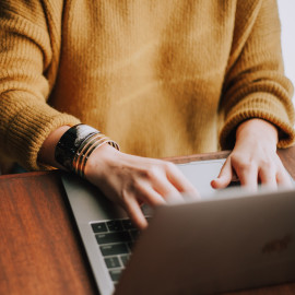 Person typing on laptop