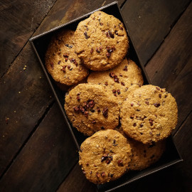 Stack of chocolate chip cookies in a tin